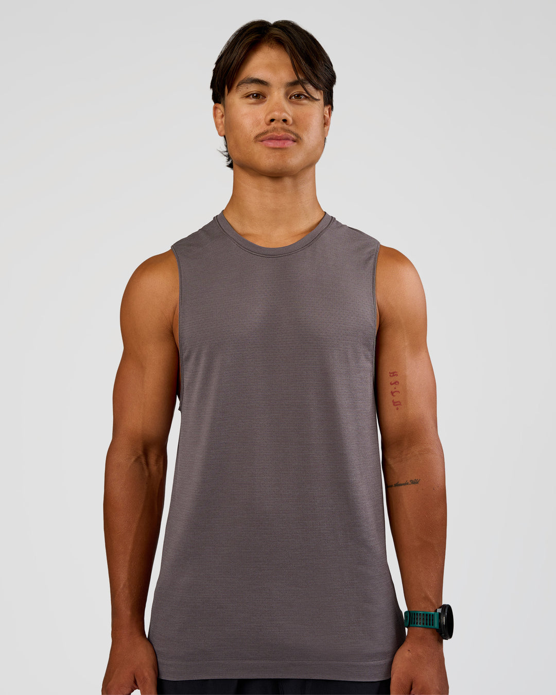 Man wearing AeroFLX+ Seamless Muscle Tank - Duskstone/Duskstone | Model:George | Size:M - view 1
