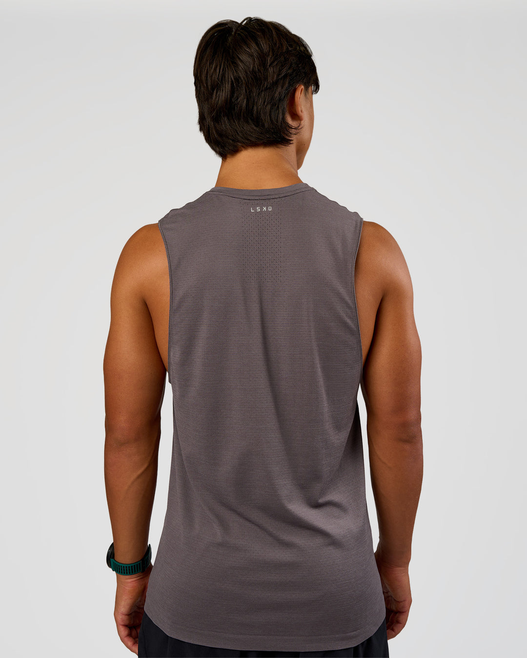 Man wearing AeroFLX+ Seamless Muscle Tank - Duskstone/Duskstone | Model:George | Size:M - view 4
