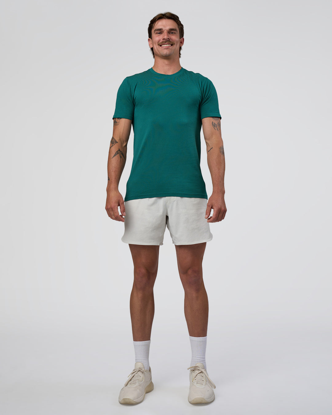 Man wearing AeroFLX+ Seamless Set In Tee - Teal/Teal | Model:Konnor | Size:M - view 3
