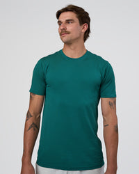 Man wearing AeroFLX+ Seamless Set In Tee - Teal/Teal | Model:Konnor | Size:M | Thumbnail Index: 0
