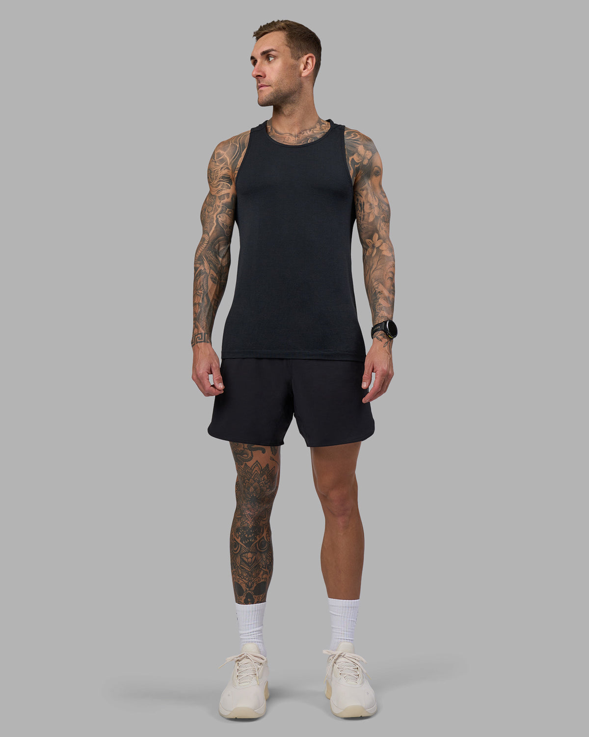Man wearing AeroFLX+ Seamless Tank - Black Marl | Model:Tommy | Size:M
