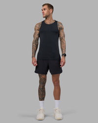 Man wearing AeroFLX+ Seamless Tank - Black Marl | Model:Tommy | Size:M | Thumbnail Index: 1