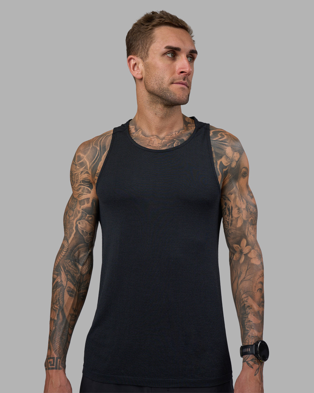 Man wearing AeroFLX+ Seamless Tank - Black Marl | Model:Tommy | Size:M - view 6
