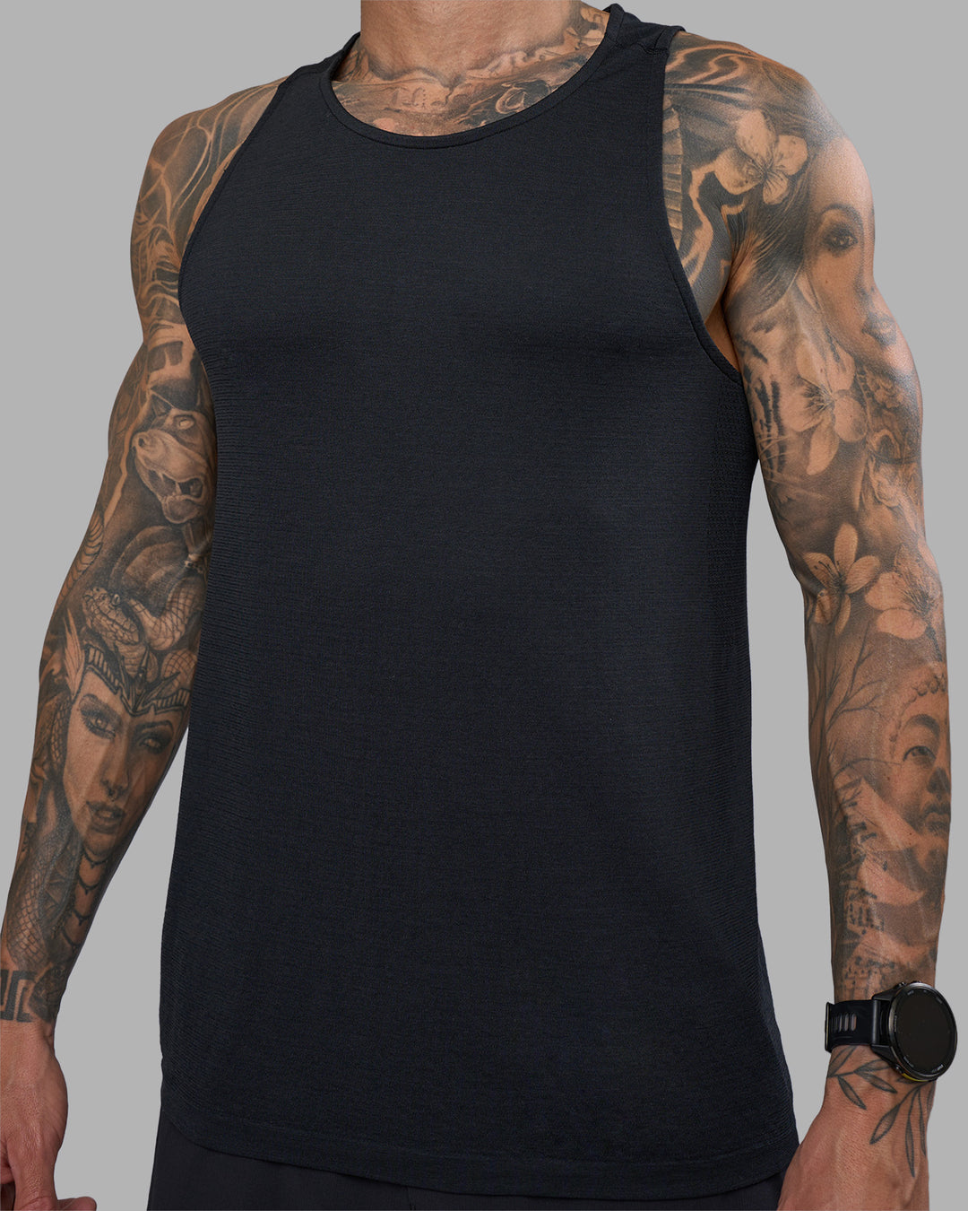 Man wearing AeroFLX+ Seamless Tank - Black Marl | Model:Tommy | Size:M - view 1