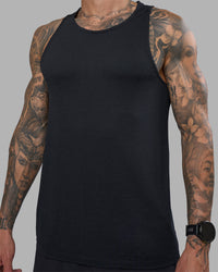 Man wearing AeroFLX+ Seamless Tank - Black Marl | Model:Tommy | Size:M | Thumbnail Index: 0