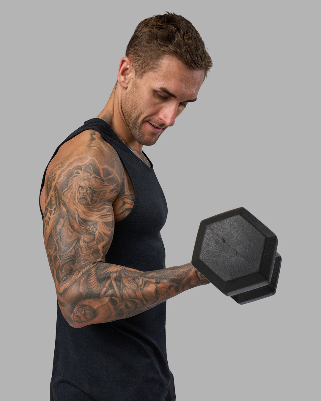 Man wearing AeroFLX+ Seamless Tank - Black Marl | Model:Tommy | Size:M - view 4