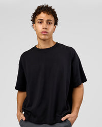 Man wearing AfterDark ZeroCrease Boxy Tee in Black | Model:Leandro | Size:M | Thumbnail Index: 0