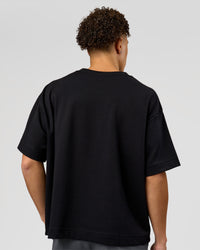 Man wearing AfterDark ZeroCrease Boxy Tee in Black | Model:Leandro | Size:M | Thumbnail Index: 9