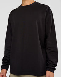 Man wearing AfterDark ZeroCrease Long Sleeve Tee - Black | Model:Leandro | Size:M | Thumbnail Index: 6