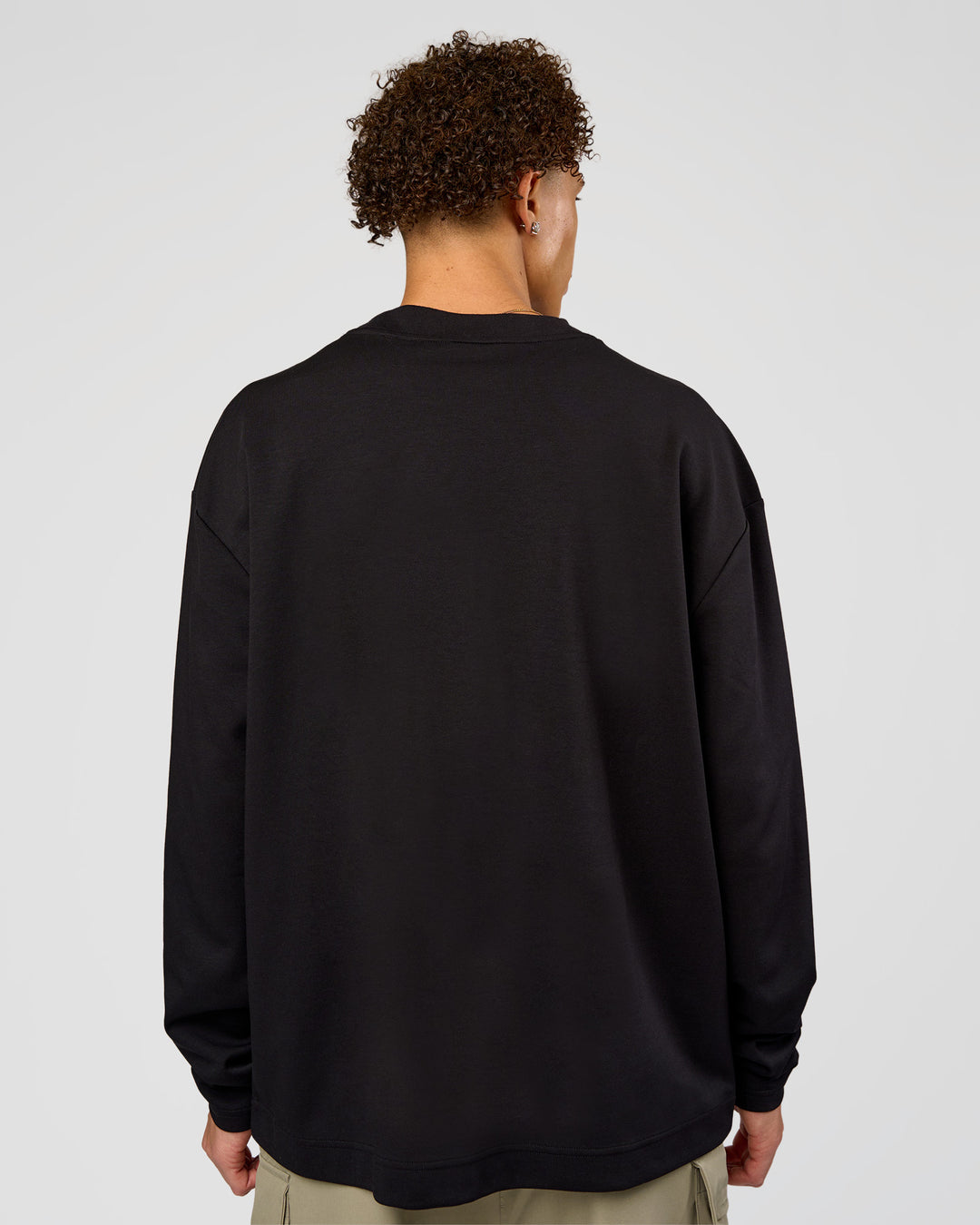 Man wearing AfterDark ZeroCrease Long Sleeve Tee - Black | Model:Leandro | Size:M - view 6