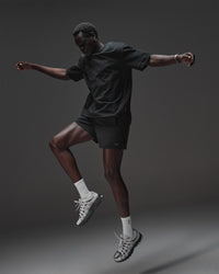 Man wearing AfterDark ZeroCrease Oversized Tee - Black | Model:Mabyro | Size:M | Thumbnail Index: 4