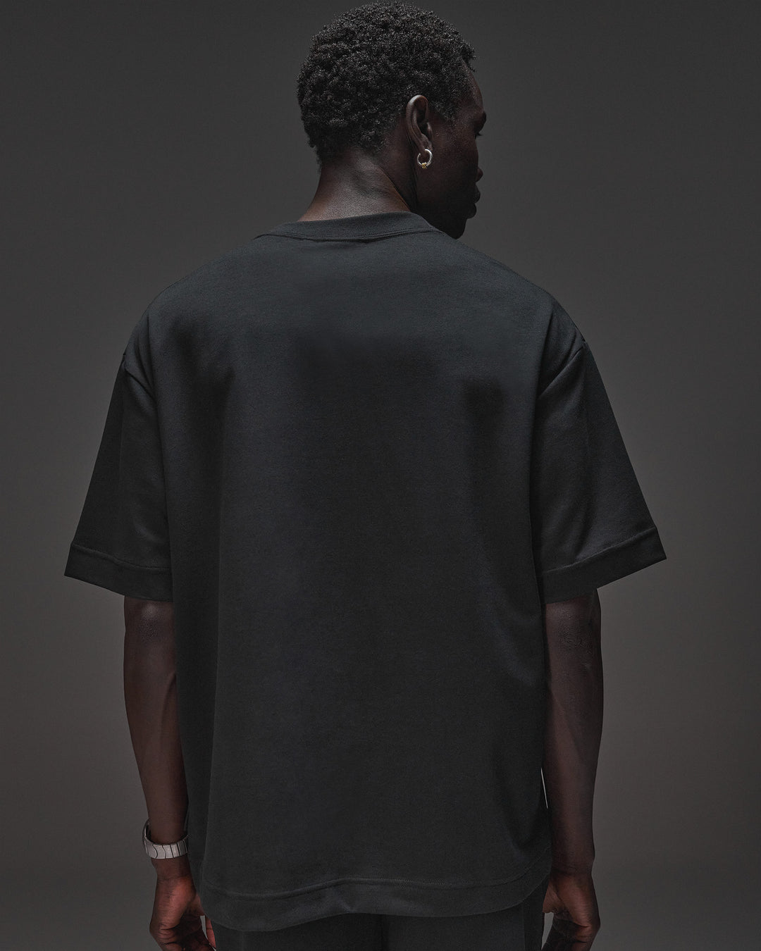 Man wearing AfterDark ZeroCrease Oversized Tee - Black | Model:Mabyro | Size:M - view 4