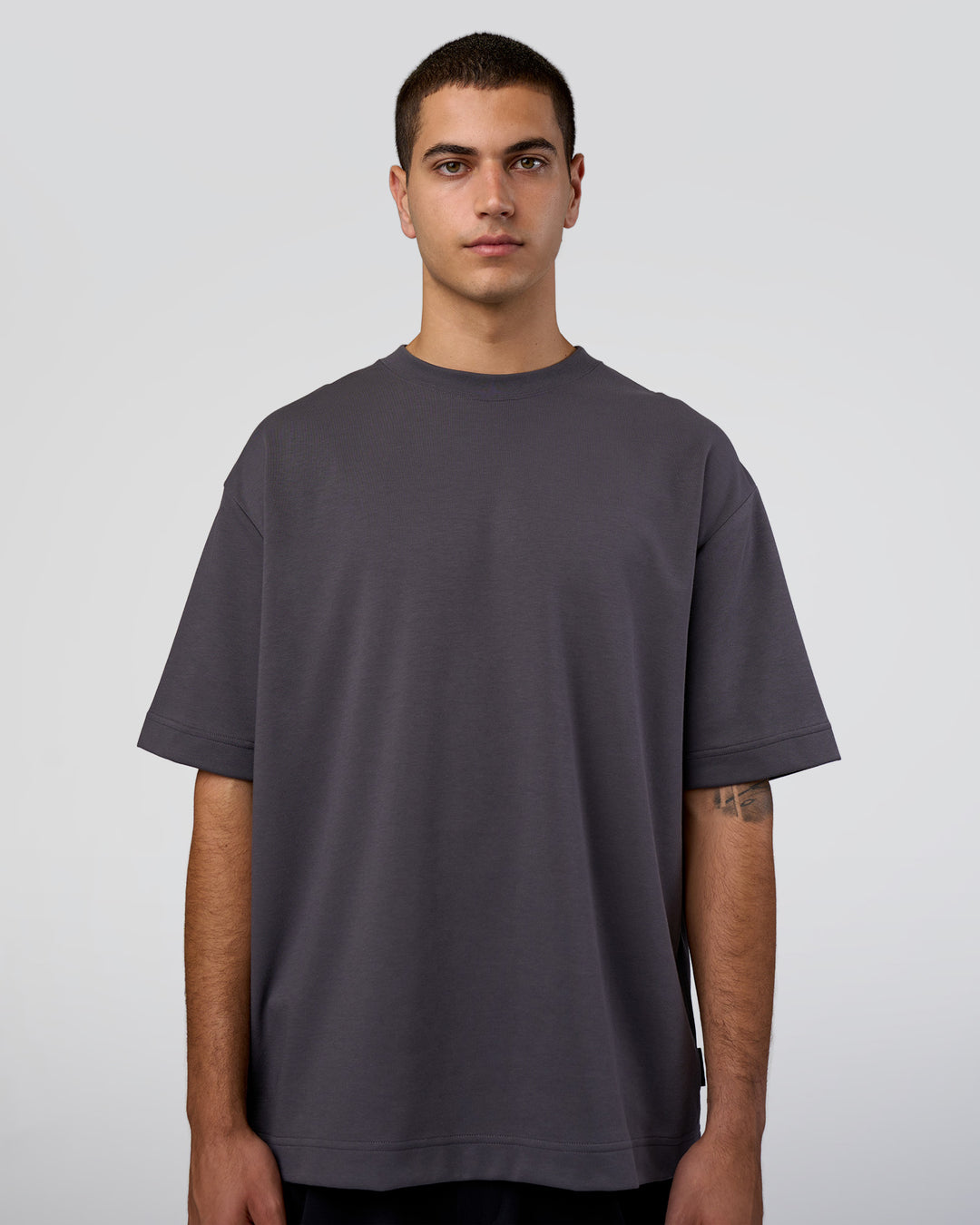 Man wearing AfterDark ZeroCrease Oversized Tee - Dark Storm | Model:Zoran | Size:M - view 2