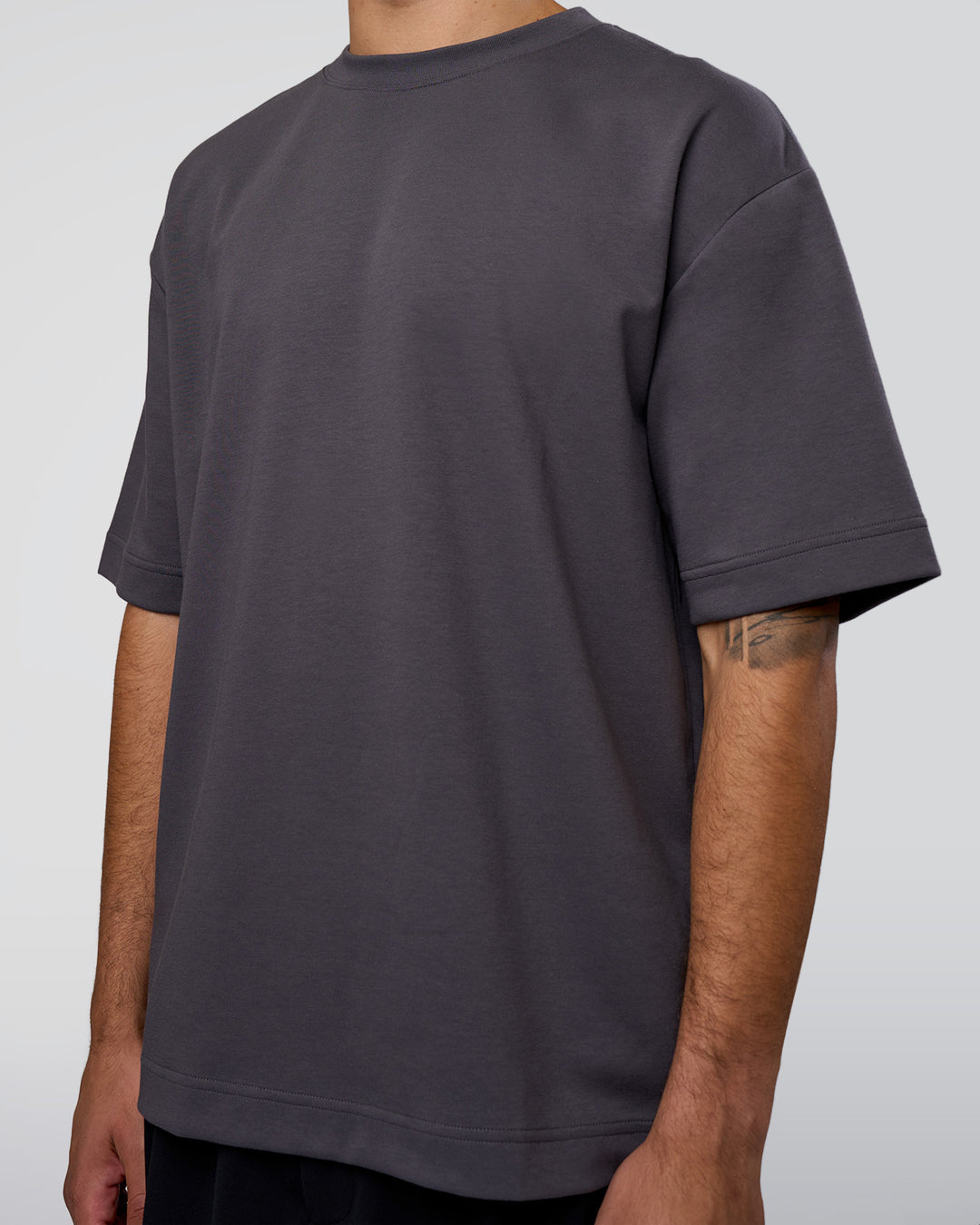 Man wearing AfterDark ZeroCrease Oversized Tee - Dark Storm | Model:Zoran | Size:M - view 11