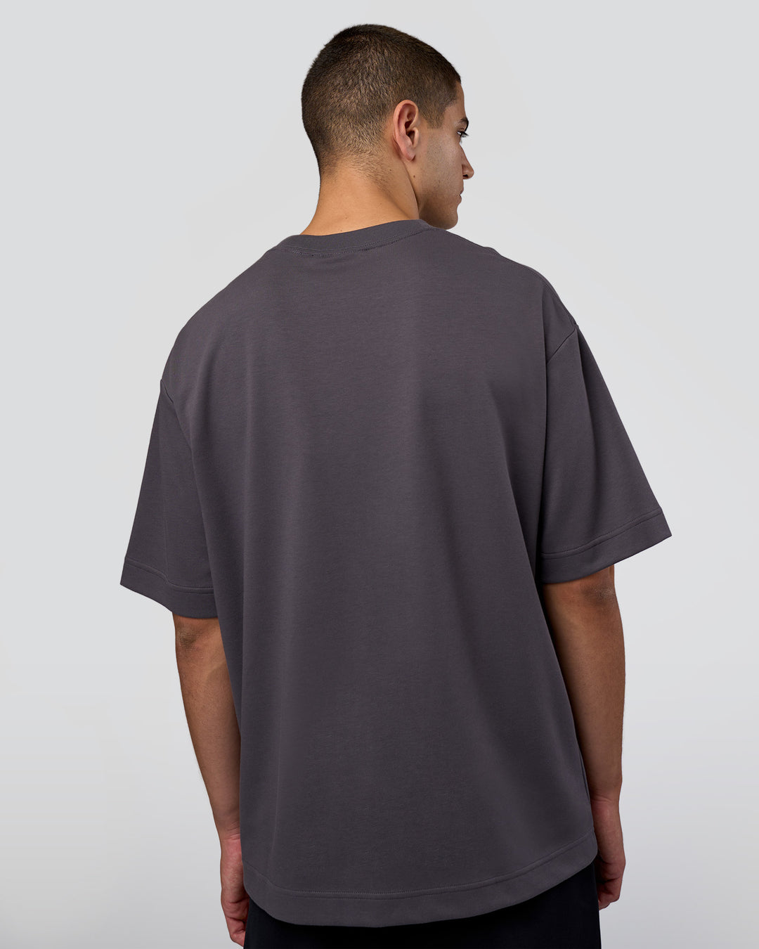 Man wearing AfterDark ZeroCrease Oversized Tee - Dark Storm | Model:Zoran | Size:M - view 6