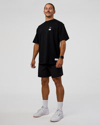 Man wearing Archive FLXCotton Oversized Tee - Black-Open Air | Model:Jaiden | Size:M | Thumbnail Index: 5