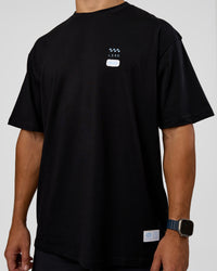 Man wearing Archive FLXCotton Oversized Tee - Black-Open Air | Model:Jaiden | Size:M | Thumbnail Index: 10