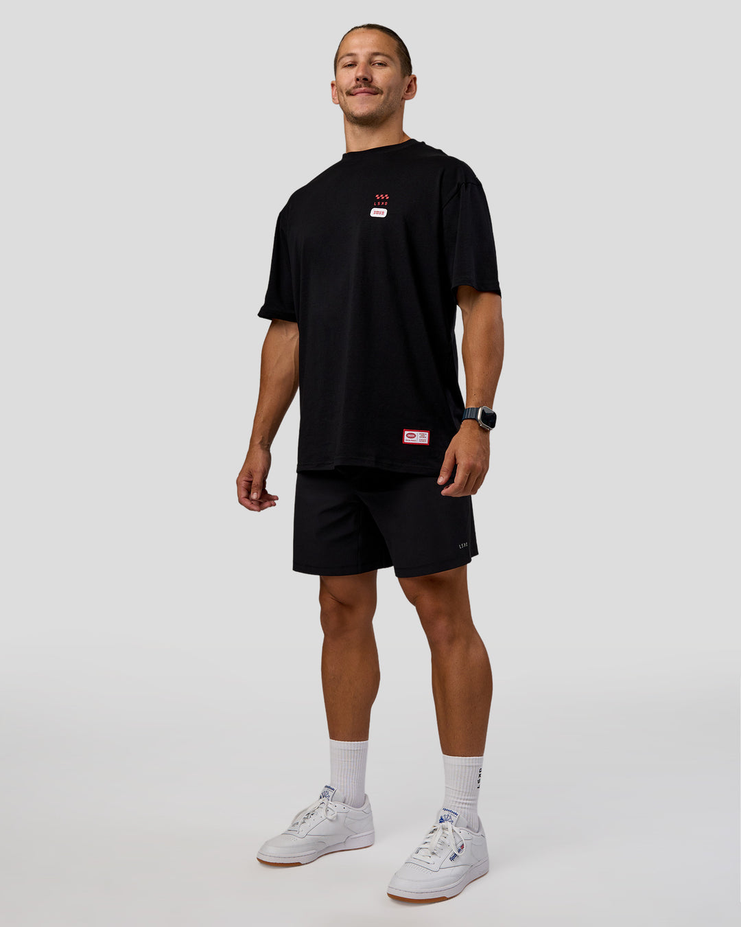Man wearing Archive FLXCotton Oversized Tee - Black-Scarlet | Model:Jaiden | Size:M - view 6