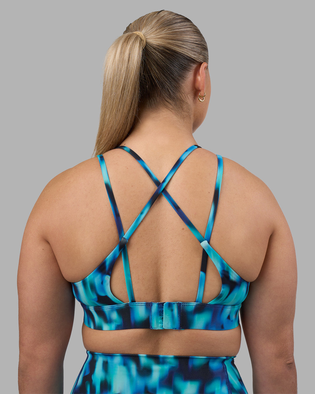 Woman wearing Aria Triangle Sports Bra - Luminous | Model:Sami | Size:M - view 2