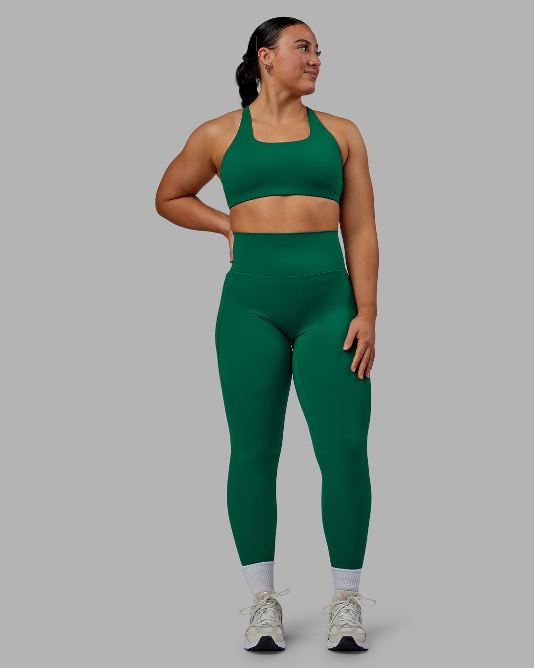 Woman wearing Aspire Sports Bra - Malachite - view 6