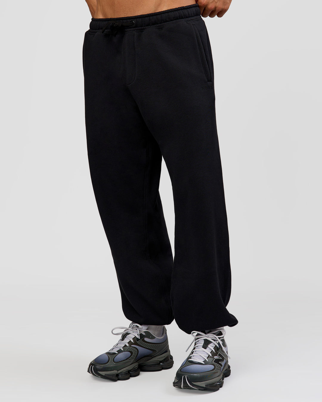 Man wearing Base Baggy Cuffed Track Pant - Black | Model:Albert | Size:M | - view 4