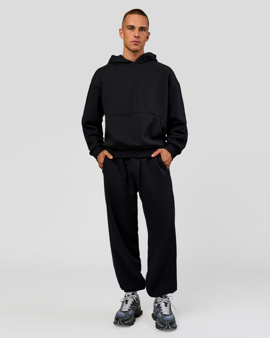 Man wearing Base Baggy Cuffed Track Pant - Black | Model:Albert | Size:M | - view 2