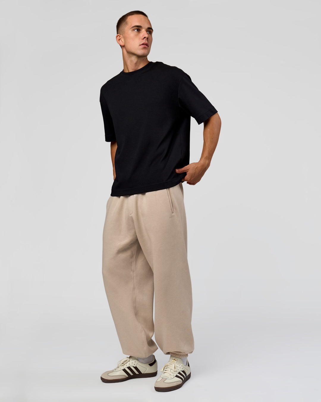 Man wearing Base Baggy Cuffed Track Pant - Shale Beige | Model:Albert | Size:M | - view 3