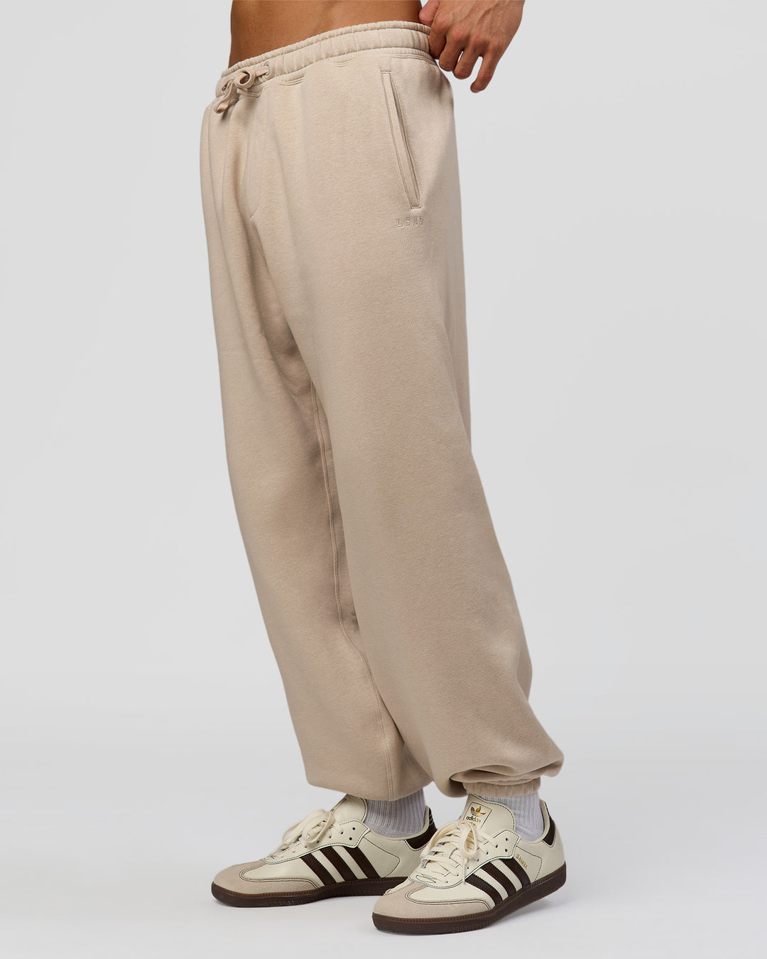 Man wearing Base Baggy Cuffed Track Pant - Shale Beige | Model:Albert | Size:M | - view 5