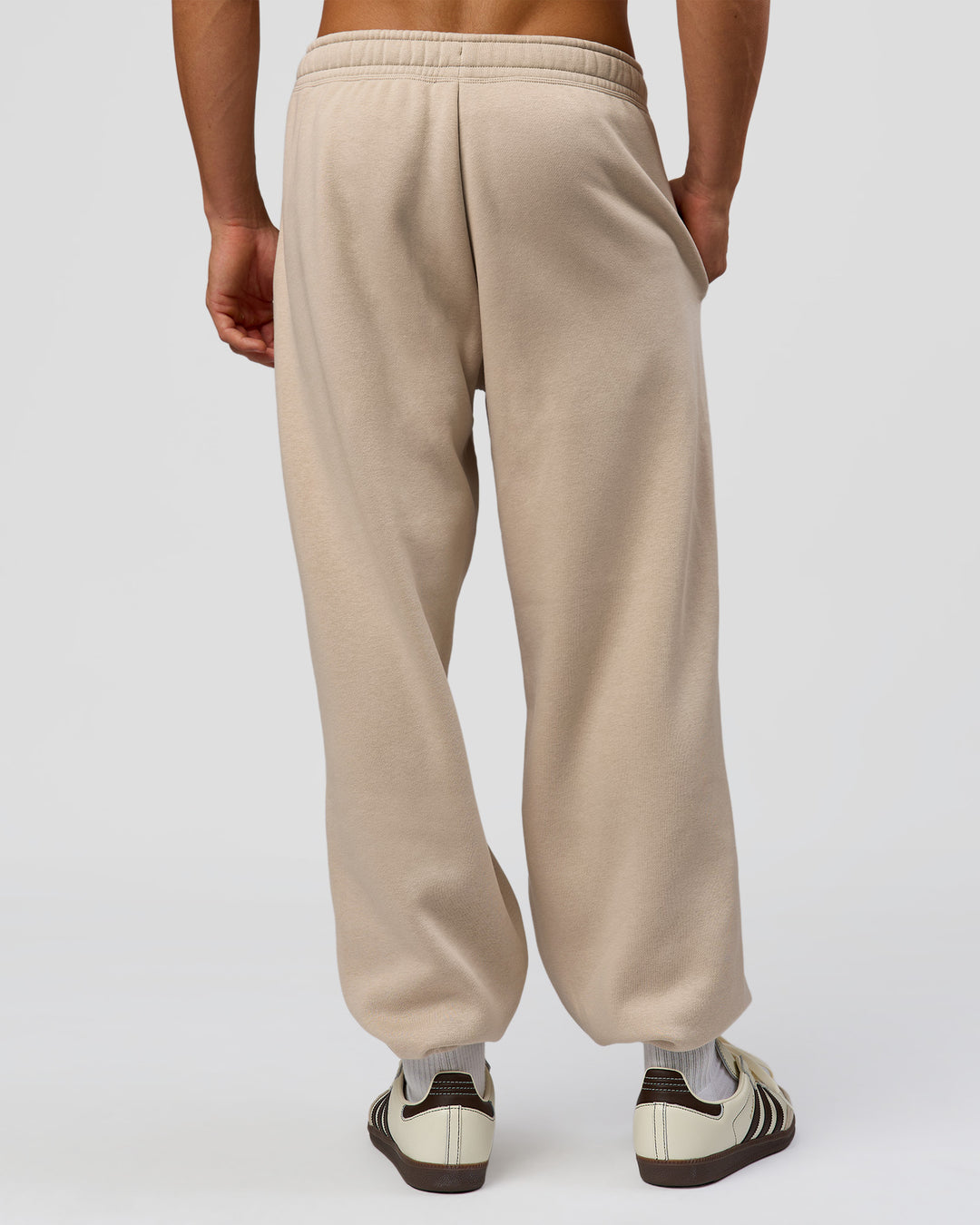 Man wearing Base Baggy Cuffed Track Pant - Shale Beige | Model:Albert | Size:M | - view 2