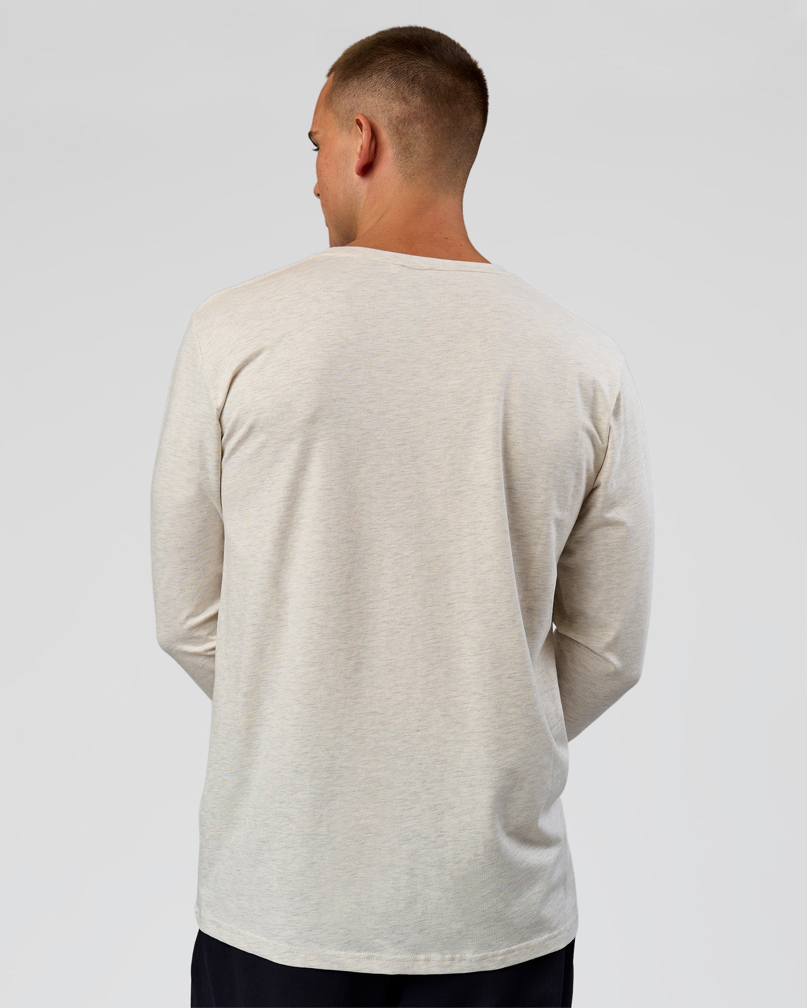 Man wearing Base FLXCotton Long Sleeve Tee in Silver Marl | Model:Albert | Size:M
