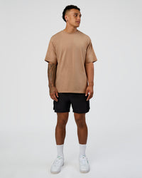 Man wearing Base FLXCotton Tee Oversized - Warm Smoke | Model:Daarian | Size:M | Thumbnail Index: 1