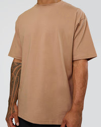 Man wearing Base FLXCotton Tee Oversized - Warm Smoke | Model:Daarian | Size:M | Thumbnail Index: 3