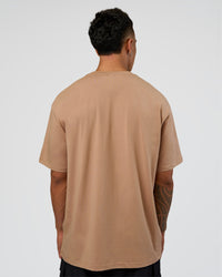 Man wearing Base FLXCotton Tee Oversized - Warm Smoke | Model:Daarian | Size:M | Thumbnail Index: 2
