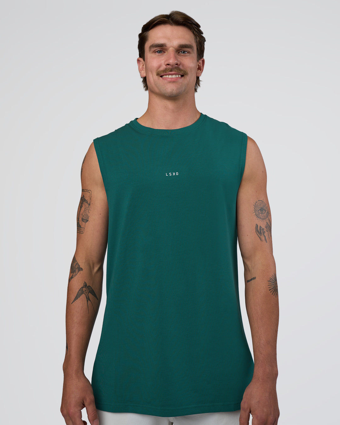 Man wearing Base FLXCotton Tank - Transformative Teal | Model:Konnor | Size:M - view 1