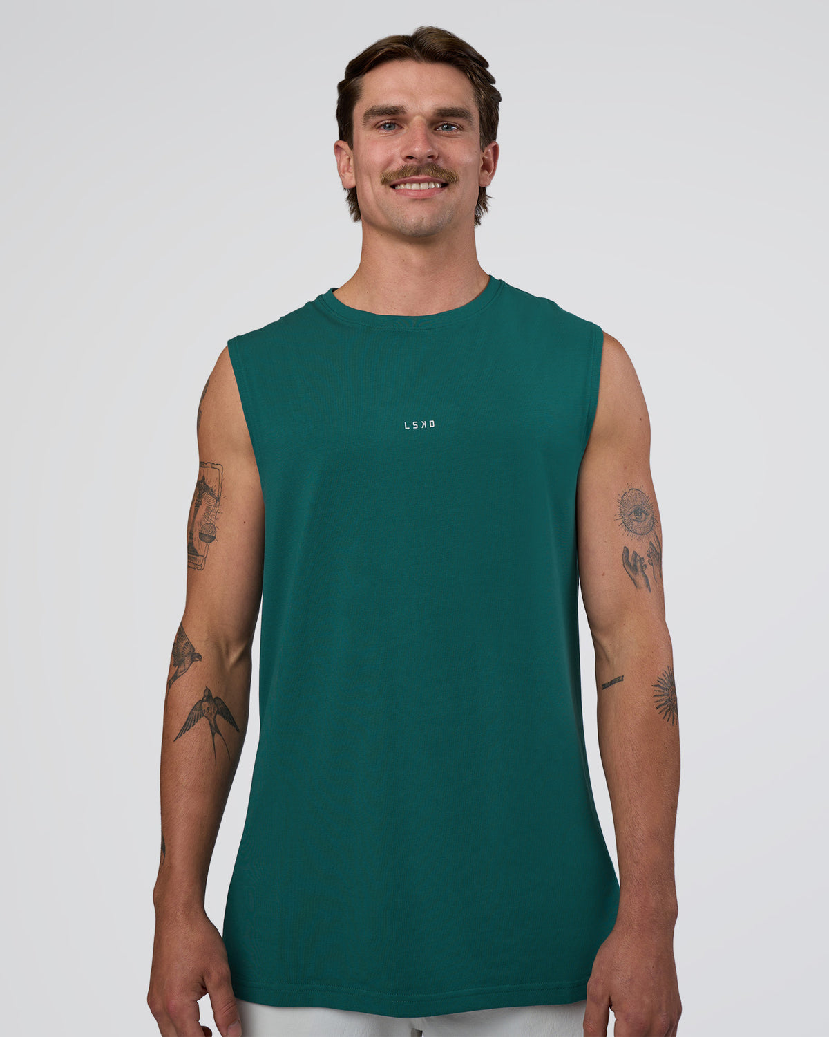 Man wearing Base FLXCotton Tank - Transformative Teal | Model:Konnor | Size:M