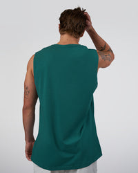 Man wearing Base FLXCotton Tank - Transformative Teal | Model:Konnor | Size:M | Thumbnail Index: 2