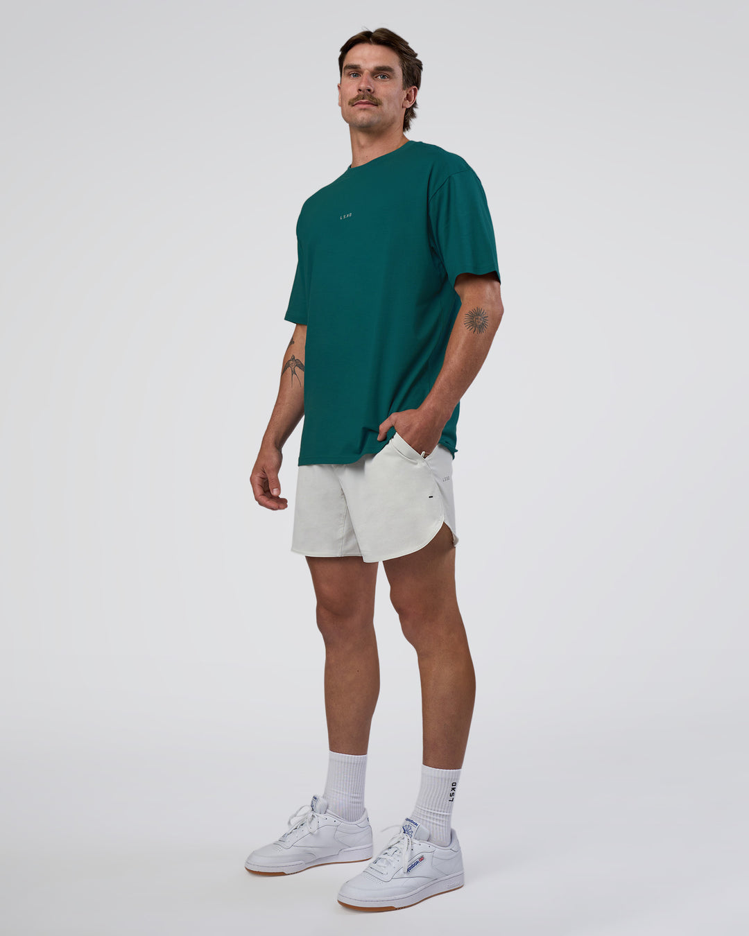 Man wearing Base FLXCotton Tee Oversized - Transformative Teal | Model:Konnor | Size:M - view 2