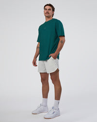 Man wearing Base FLXCotton Tee Oversized - Transformative Teal | Model:Konnor | Size:M | Thumbnail Index: 1