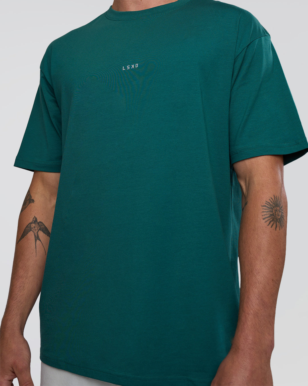 Man wearing Base FLXCotton Tee Oversized - Transformative Teal | Model:Konnor | Size:M - view 5