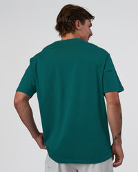 Man wearing Base FLXCotton Tee Oversized - Transformative Teal | Model:Konnor | Size:M | Thumbnail Index: 2