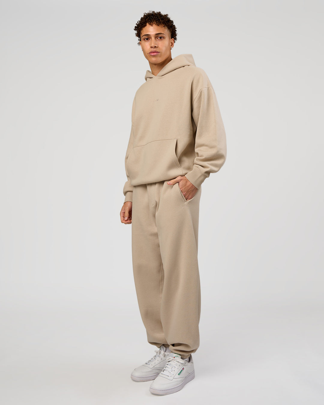 Man wearing Base Oversized Hoodie - Shale Beige | Model:Leandro | Size:M | - view 6