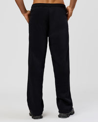 Man wearing Base Wide Leg Track Pant - Black | Model:Albert | Size:M | | Thumbnail Index: 0