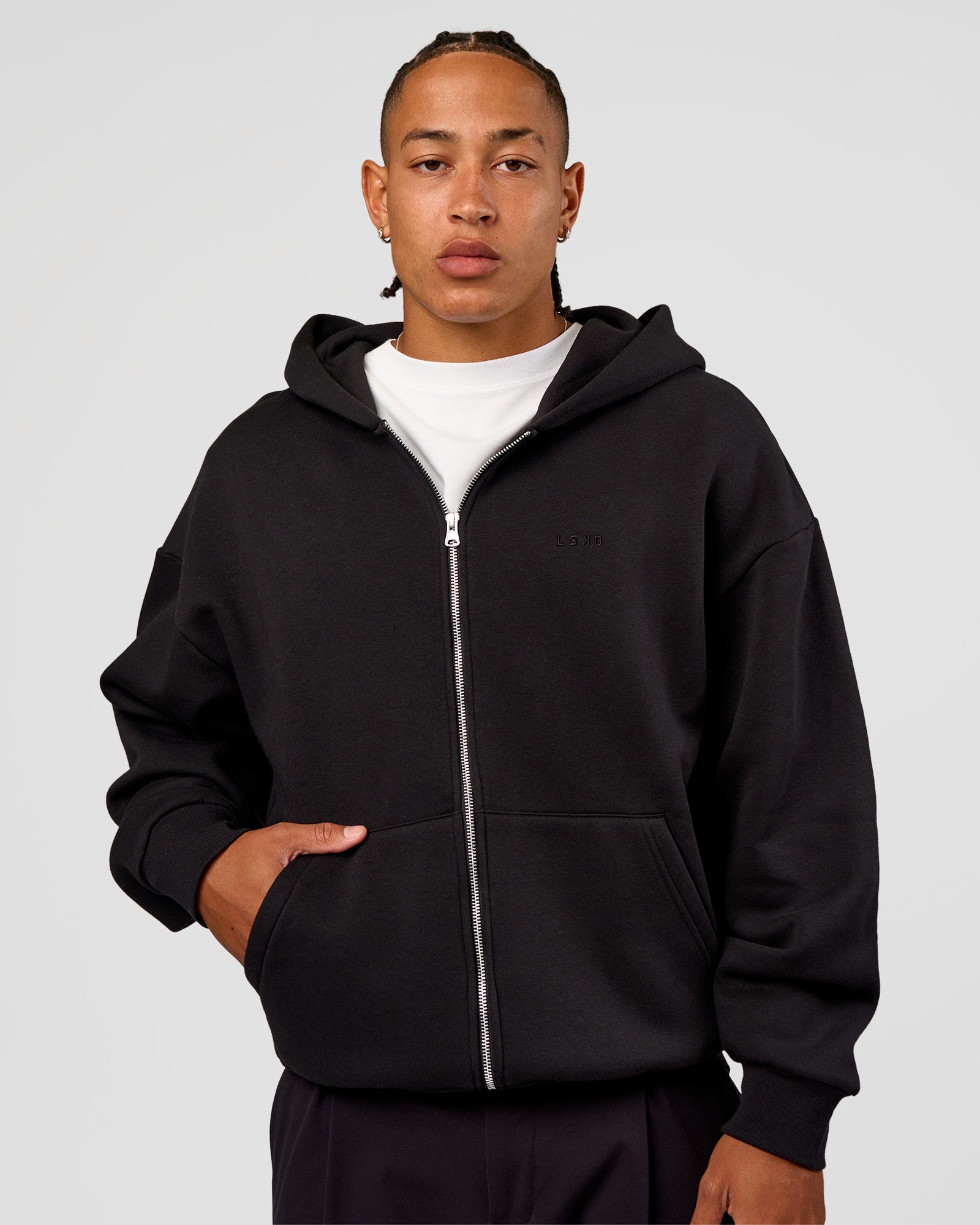 Man wearing Base Zip Through Oversized Hoodie - Black | Model:Malebo | Size:M