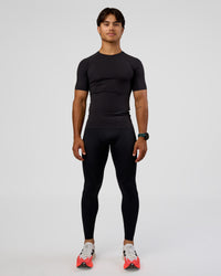 Man wearing BaseTech 26" Leggings - Black | Model:George | Size:M | Thumbnail Index: 9