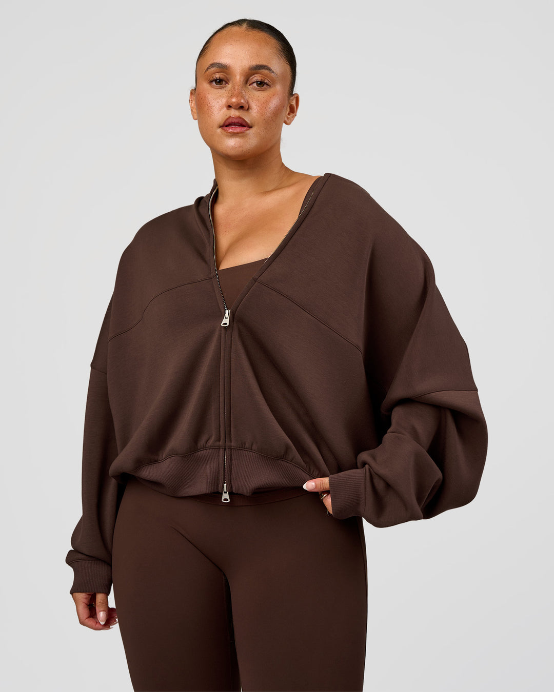 Woman wearing CF Elevate SoftTouch Bomber - Hot Chocolate | Model:Simmy | Size:M - view 7