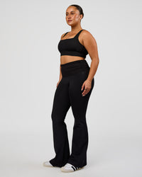 Woman wearing CF Fold Over High-Rise Flared Legging - Black | Model:Simmy | Size:M | Thumbnail Index: 6