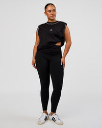 Model wearing CF Fold Over High-Rise Full Length Legging - Black | Model:Simmy | Size:M | Thumbnail Index: 0