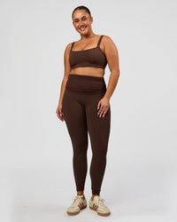 Woman wearing CF Fold Over High-Rise Full Length Legging - Hot Chocolate | Model:Simmy | Size:M | Thumbnail Index: 2