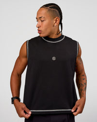 Man wearing CF Unisex Oversized Heavyweight Boxed Tank - Black-CF X LSKD Sport | Model:Malebo | Size:M | Thumbnail Index: 5
