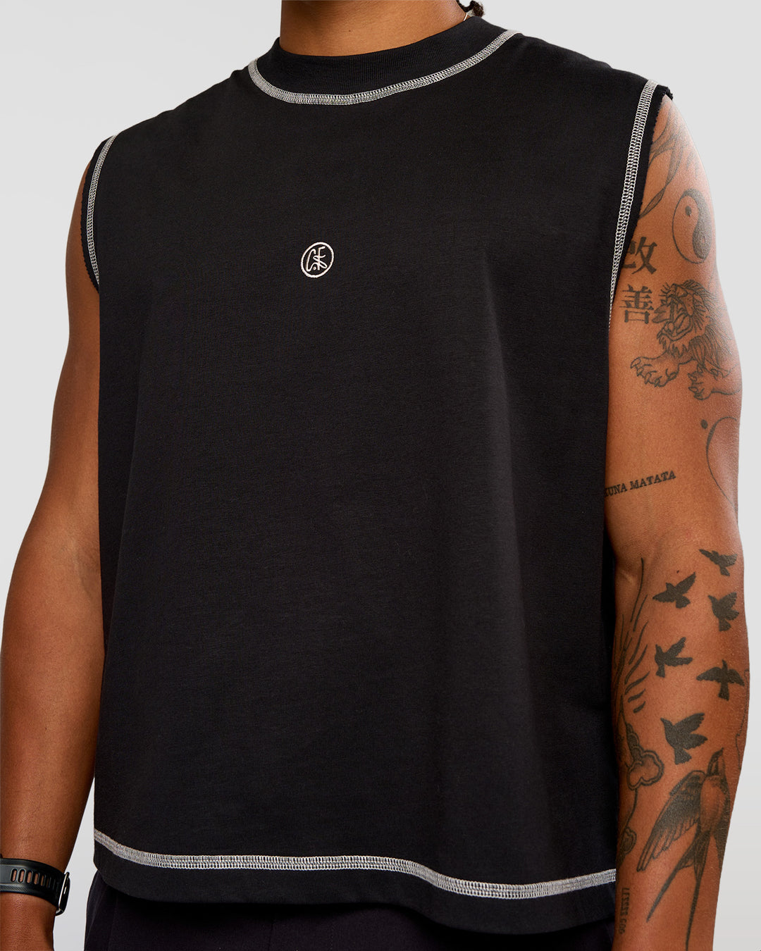 Man wearing CF Unisex Oversized Heavyweight Boxed Tank - Black-CF X LSKD Sport | Model:Malebo | Size:M - view 10